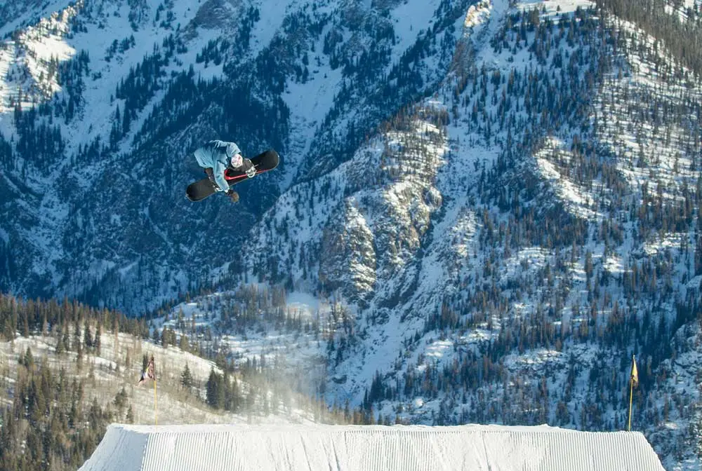 Central Park at Woodward Copper's Mountain Park: Snowboarder Jumping