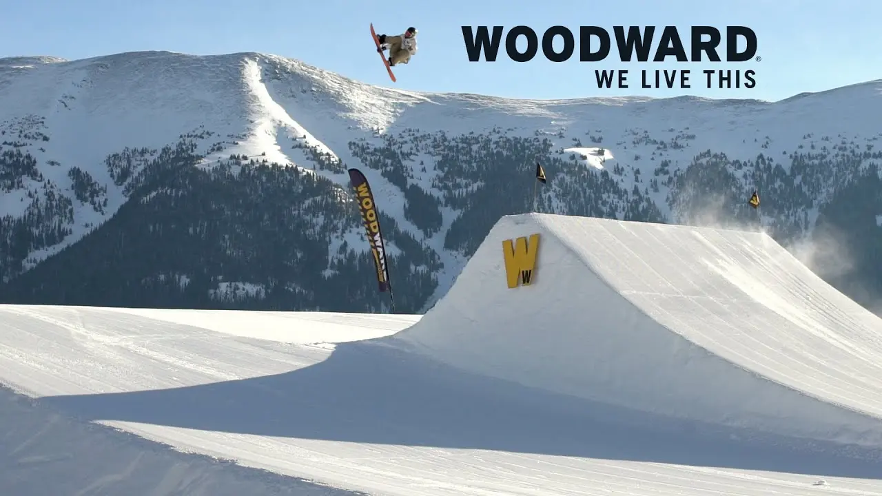 Snowboarder going off a large jump