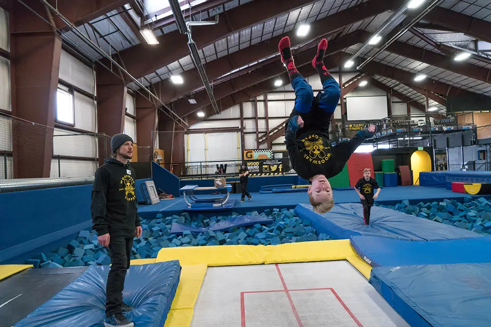 backflipping on a trampoline with barn coach