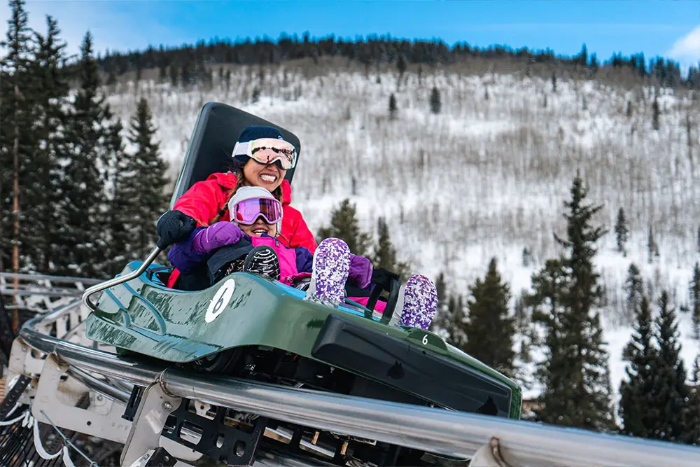 mom and daughter on the rocky mountain coaster