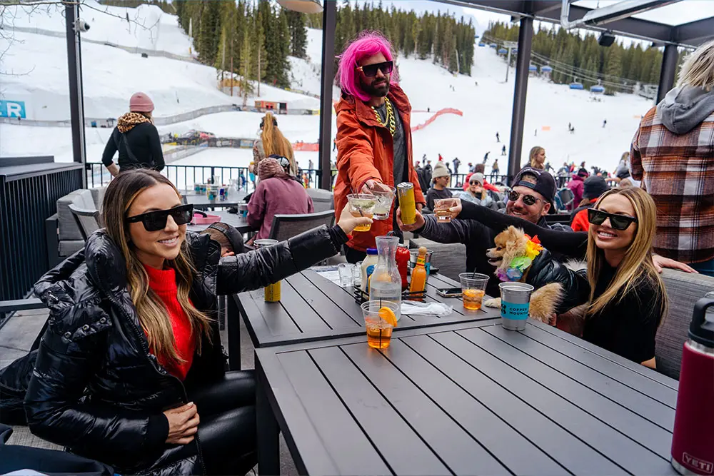 briends enjoying apres at downhill duke's patio
