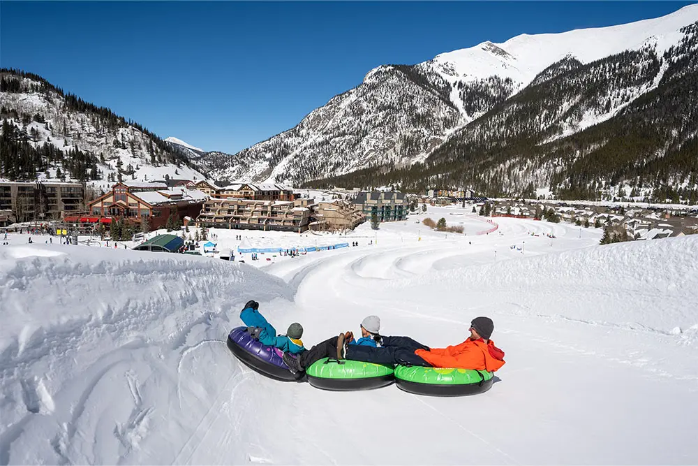 family at the tubing hill in east village