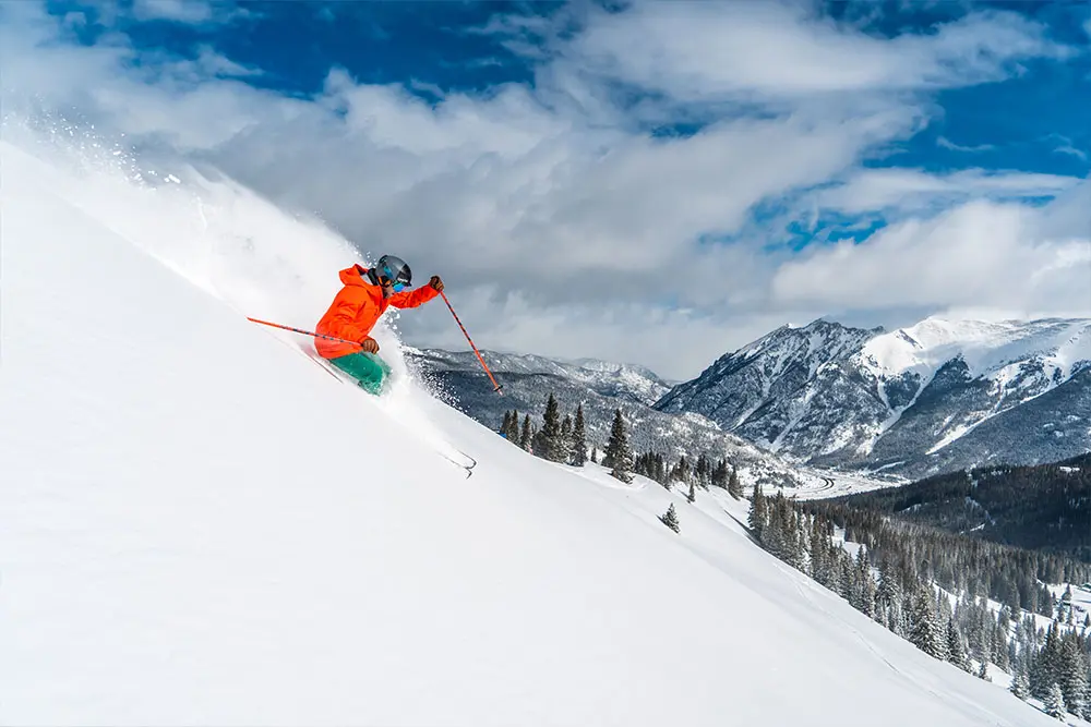 skier in powder on the east side of copper